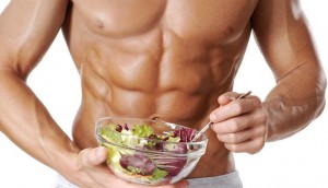 muscular man eating salad