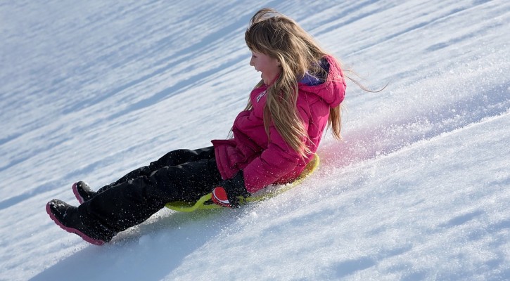 woman sliding on snow