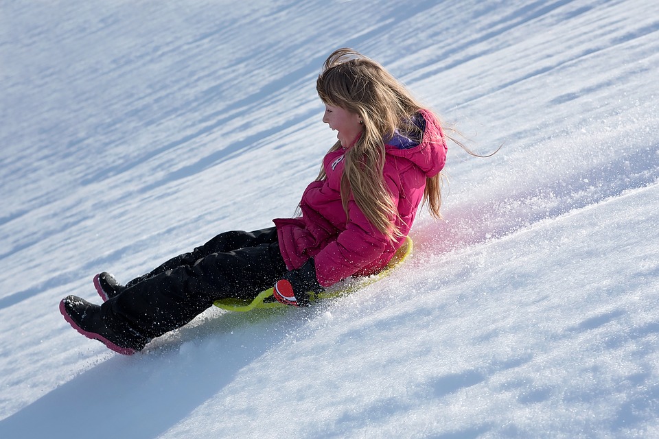 woman sliding on snow