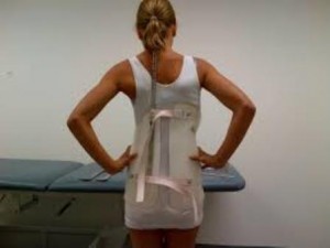 woman sizing the back brace